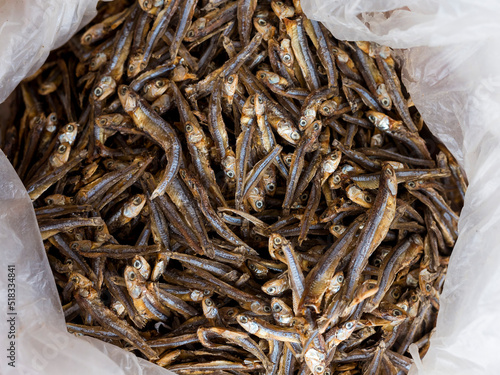 Sun dried dilis or anchovy inside a plastic bag at a dry fish market in the Philippines. photo