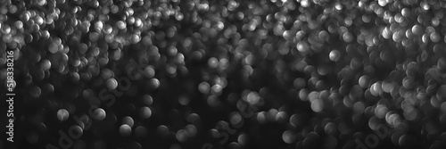 Fotografie, Obraz Gray black sparkling glitter bokeh background, christmas abstract defocused texture