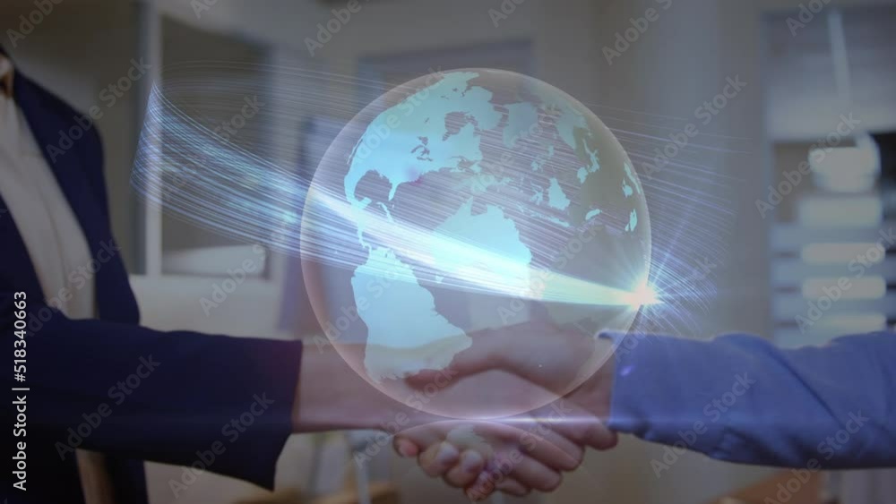 Light trails over a globe against mid section of businessman and businesswoman shaking hands