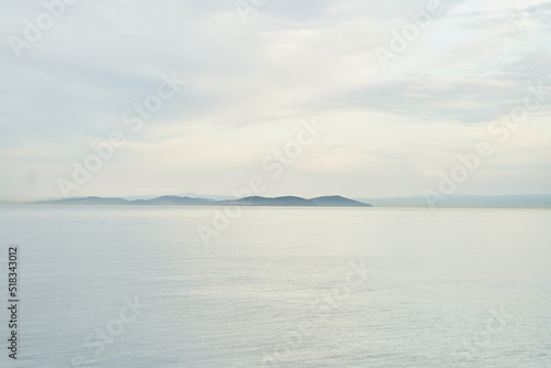 View of the sea and mountains in the fog