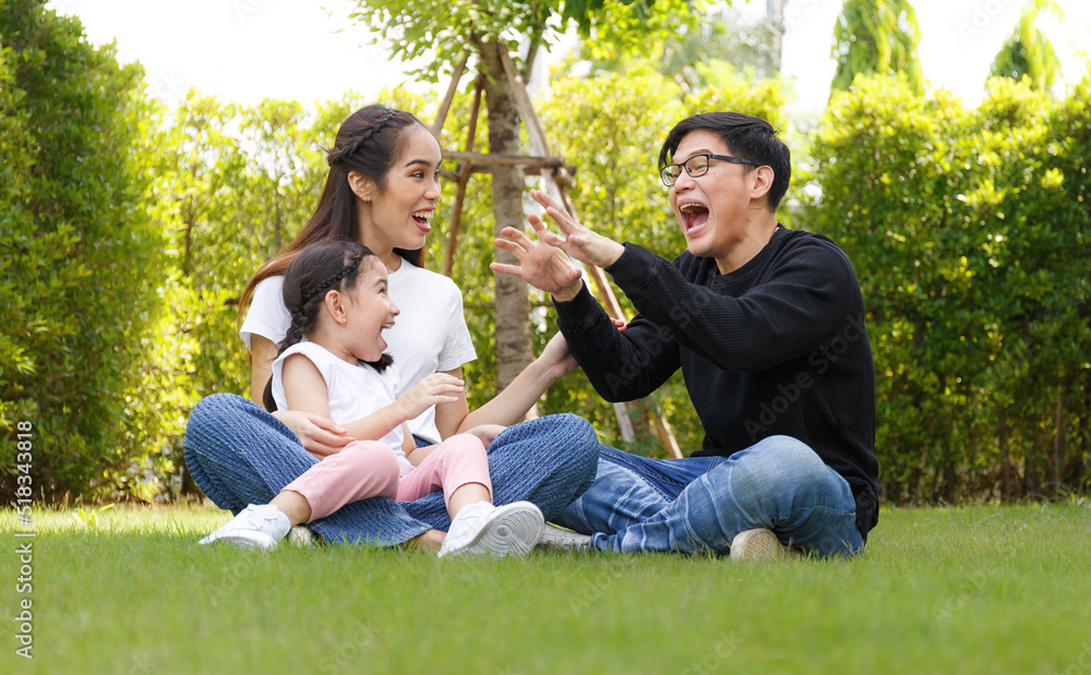 Asian family A cute and bright daughter is resting by running in the field.