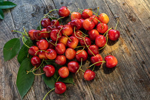 red cherries on wooden table