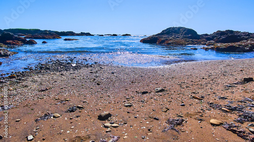 Wallpaper Mural Waves on sandy beach with shiny pieces of glass Torontodigital.ca