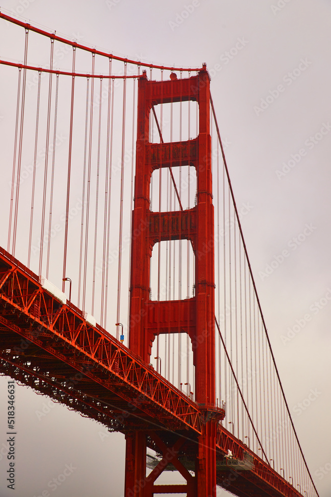 Obraz premium Vertical of part of Golden Gate Bridge on foggy morning