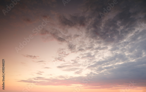 Dark clouds in a sunset sky background with copy space. Cloudscape climate view of dramatic sky with signs of thunder storm on the horizon. Landscape of the sun at dusk in autumn or winter weather