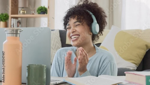 Cheerful online tutor clapping her hands to motivate her students while working remotely at home. Excited black ESL teacher showing her learners how to express joy with gestures in a virtual class photo