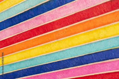 pattern background of colored or multi-colored diagonal stripes, in recycled material. Fiber textured paper. 
