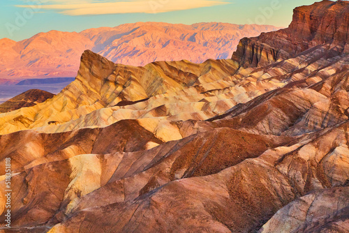 Zabriskie Point colorful sediment waves of mountains in desert at sunrise