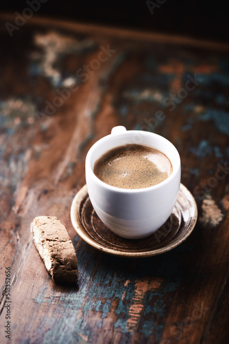 Cup of coffee and Cantuccini  Italian cookie  on dark wooden background. Close up. Copy space.