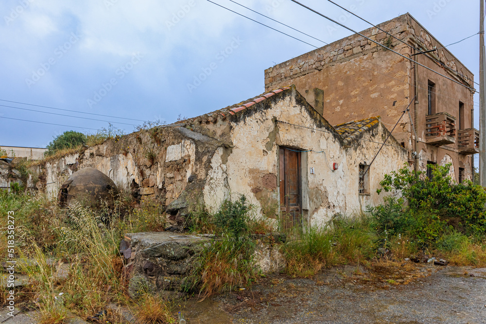 Old dilapidated abandoned house with traditional oven on the island of Sardinia