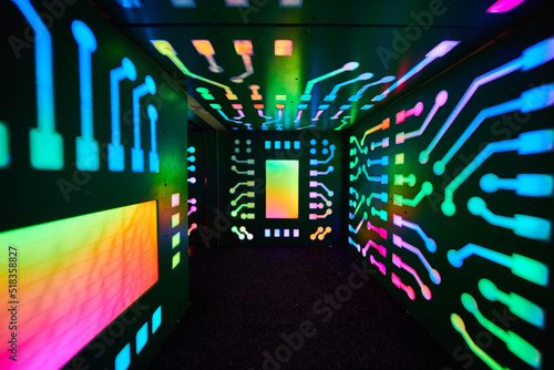 Small tunnel of rainbow computer lights © Nicholas J. Klein
