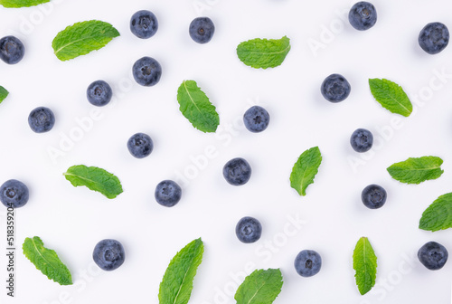 background of berries , blueberries with mint leaves on a white background - the concept of a healthy diet.summer bright background,food design