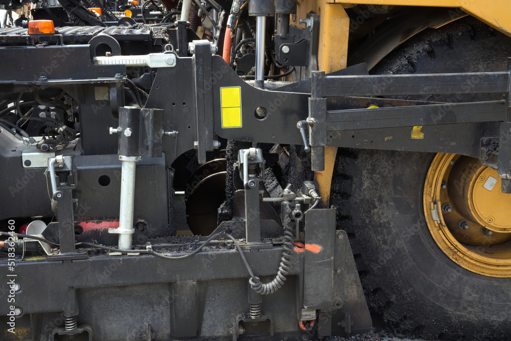 road construction industry heavy equipment asphalt machine road paving mechanic tool close-up