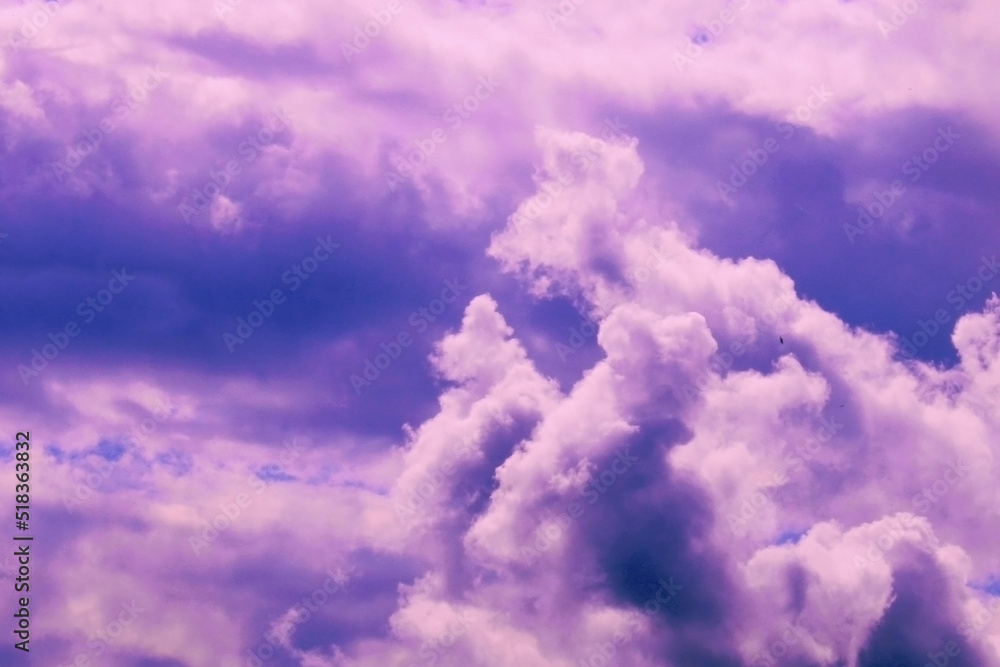 Beautiful pink storm clouds on a blue sky. Beauty of nature. Natural background. Beautiful pink storm clouds on a blue sky. Beauty of nature. Natural background.