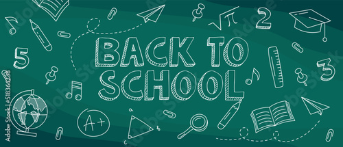 Back to school hand-drawn doodles blackboard background. "Welcome back to school" text drawing by white chalk in blackboard with school items and elements. Banner design. Education concept