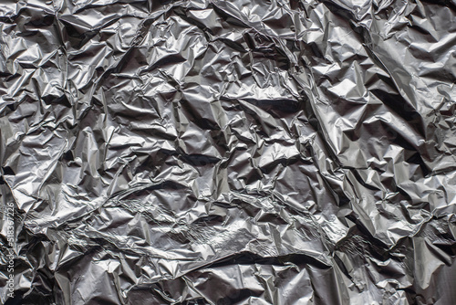 crumpled aluminium foil flat background and texture.