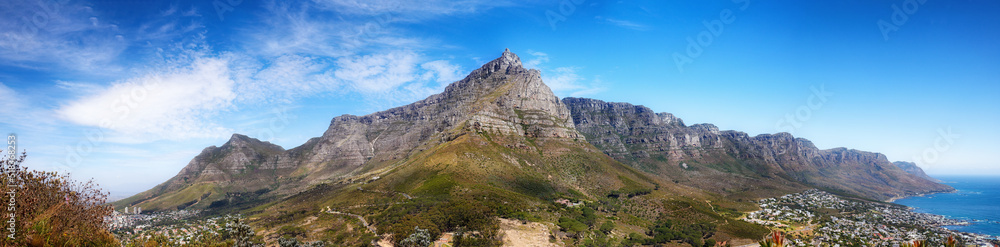 Landscape panorama of mountains, sea and coastal city with blue sky in famous travel and tourism destination. Copy space and scenic nature view of Table Mountain reserve in Cape Town, South Africa Landscape panorama of mountains, sea and coastal city with blue sky in famous travel and tourism destination. Copy space and scenic nature view of Table Mountain reserve in Cape Town, South Africa