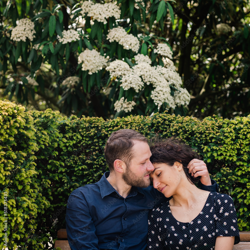 Lovely young couple on a park bench Lovely young couple on a park bench