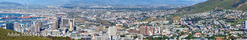 Landscape view of the city Cape Town in South Africa. Wide screen and scenic view of an urban town with greenery and nature during summer. Banner of residential buildings in the Western Cape © SteenoWac/peopleimages.com
