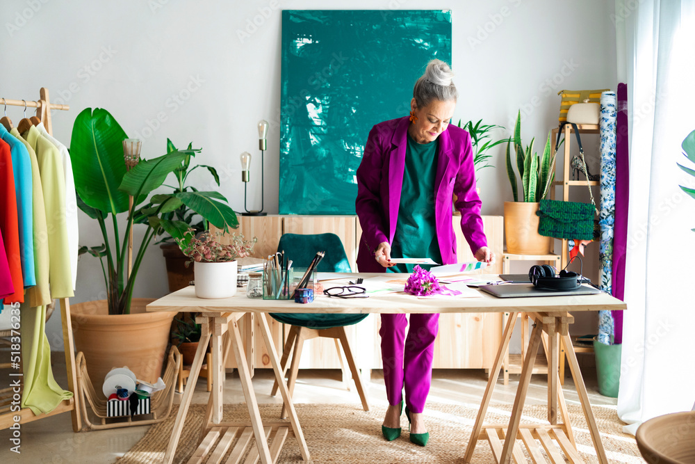 Fashion designer woman working in atelier Fashion designer woman working in atelier