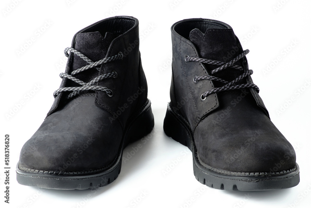 Black suede chukka boots isolated on white. Black suede chukka boots isolated on white.