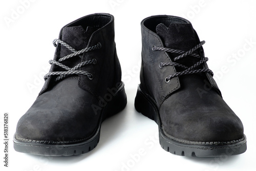 Black suede chukka boots isolated on white. 