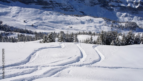 snow covered ski slopes in snowy winter in Swiss Alps