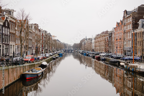 Main channel with boats in Amsterdam photo