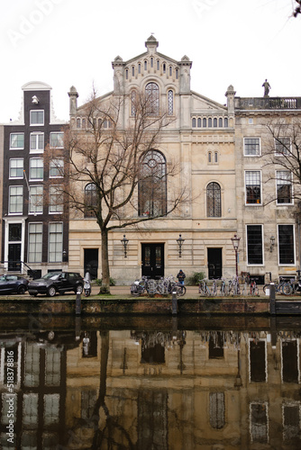 Picturesque buildings located on waterfront with parked vehicles photo