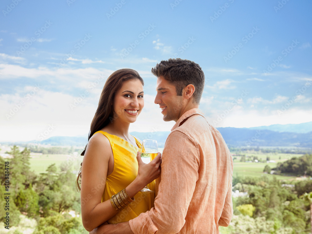 Portrait of couple drinking wine on vacation in Napa Valley