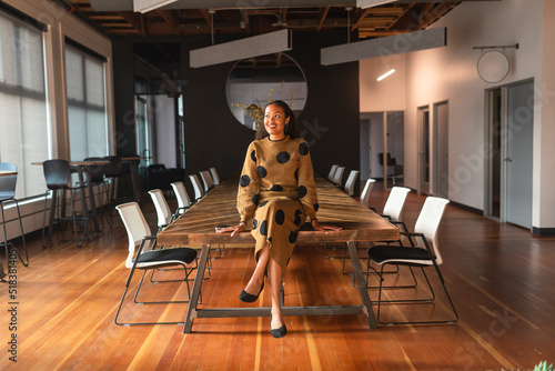 Pretty executive woman at meeting room table