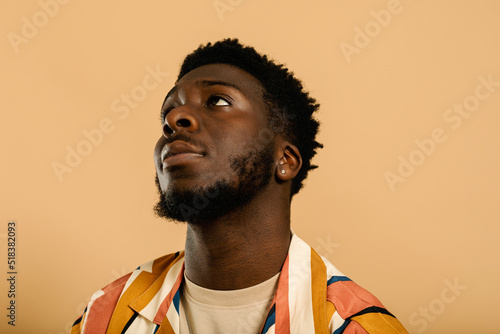 Cool black man in striped shirt summer studio portrait photo