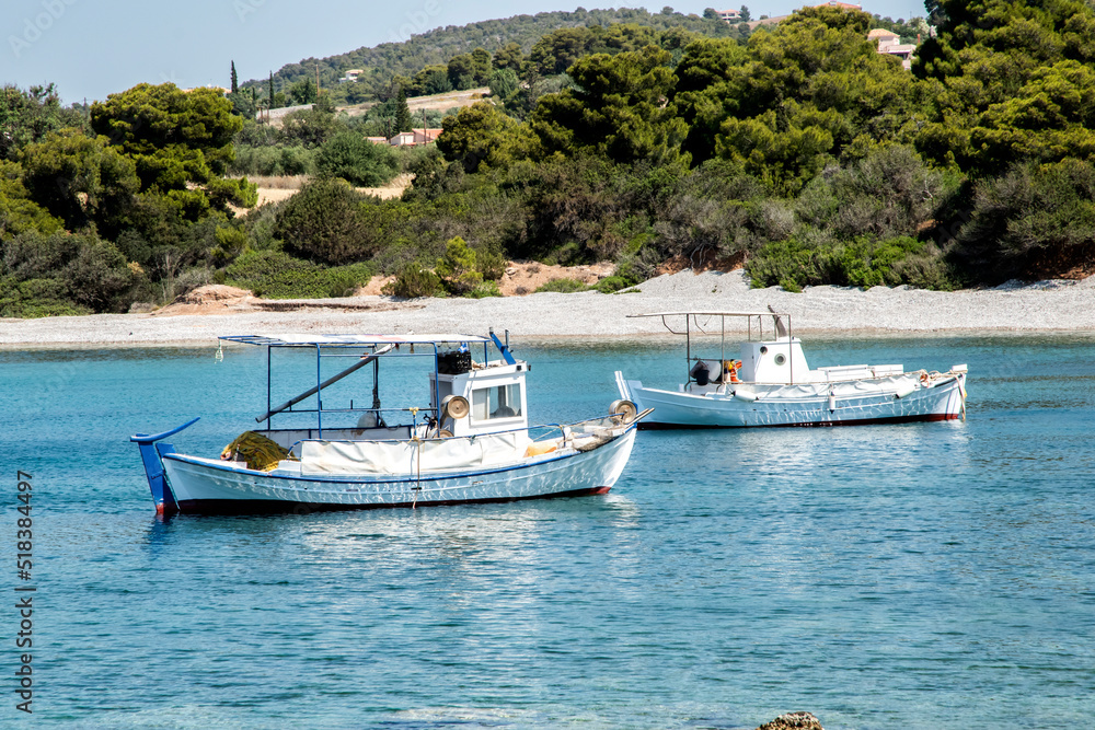 Naklejka premium Fishing boats in small Mediterranean bay in sunny summer day