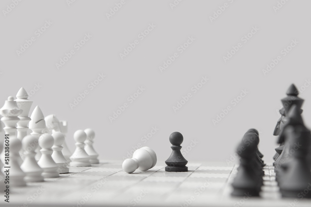 © Yaroslav Danylchenko/Stocksy - Chess board game