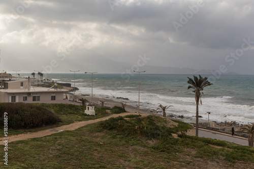 A winter day on the beach street of Heraklion. Cloudy day, with a rough sea in the background. View over the old venetian walls. 