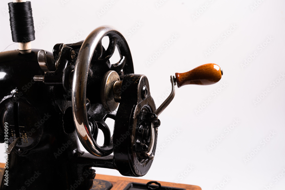 Old sewing machine on a white background