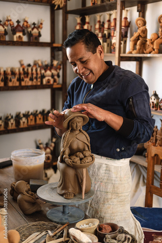 Artisan working with clay photo