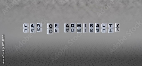 law of admiralty word or concept represented by black and white letter cubes on a grey horizon background stretching to infinity photo