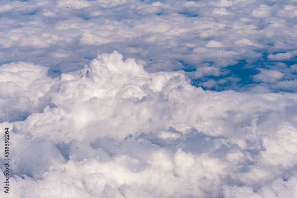 Clouds outside my airplane window from a comfortable cruising altitude Clouds outside my airplane window from a comfortable cruising altitude