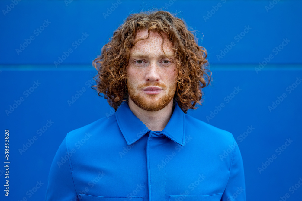 © Bisual Studio/Stocksy - Ginger man in blue clothes © Bisual Studio/Stocksy - Ginger man in blue clothes