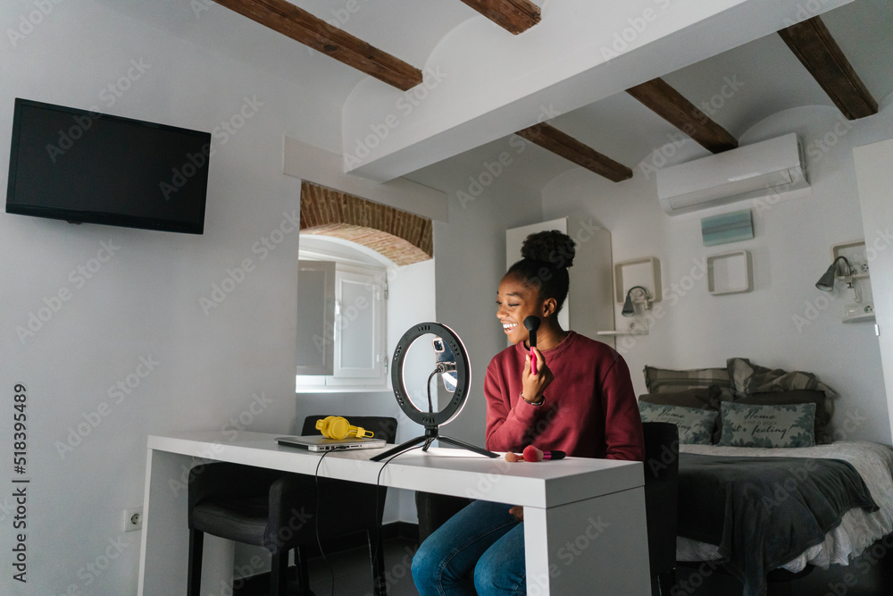 Black woman shooting video for beauty blog Black woman shooting video for beauty blog