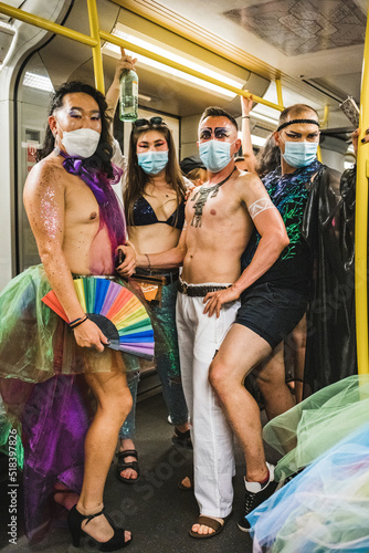 Four friends in subway going to Pride photo