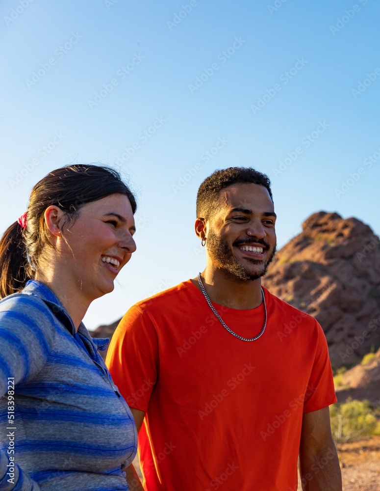two Friends taking a rest while Hiking in Arizona Desert landscape two Friends taking a rest while Hiking in Arizona Desert landscape