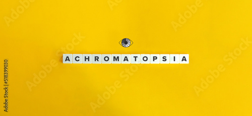 Achromatopsia Banner. Total Color Blindness and Hereditary Visual Disorder. Letter Tiles on Yellow Background. Minimal Aesthetics. photo