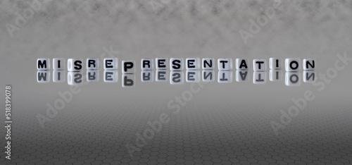 misrepresentation word or concept represented by black and white letter cubes on a grey horizon background stretching to infinity photo