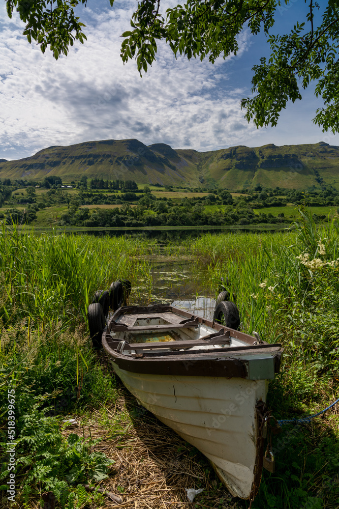 old wooden fishing boat on the shores of Glencar Lough old wooden fishing boat on the shores of Glencar Lough