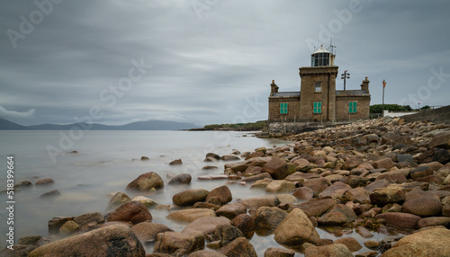 view of the historic 19th-century Blacksod Lighthouse on the Mullet Peninsula in County Mayo in Ireland photo