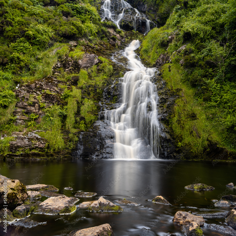 view of the picturesque Assaranca Waterfall on the coast of County Donegal in Ireland