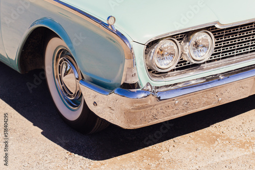 Vintage Aqua Car with Chrome Bumper and Whitewall Tires