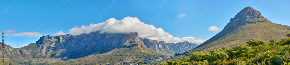 Panoramic landscape of Table Mountain and Lions Head in Cape Town, South Africa. Aerial view of a majestic and breathtaking blue sky background over a natural wilderness environment during summer